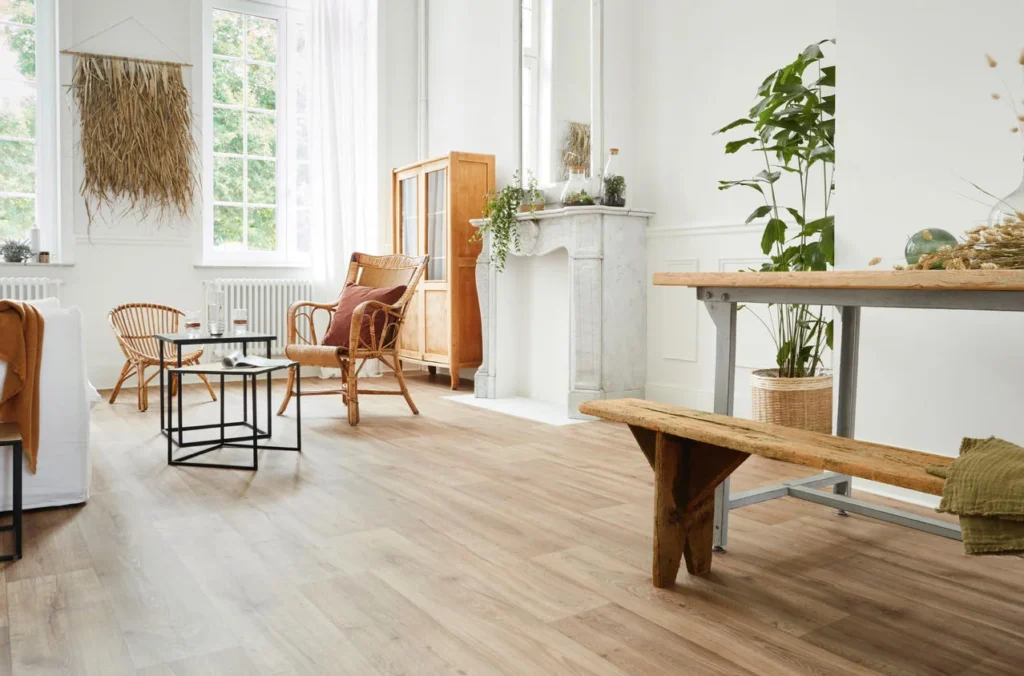 Modern living room with light wood flooring, minimalist furniture, and natural decor elements – ideal for home renovation inspiration.