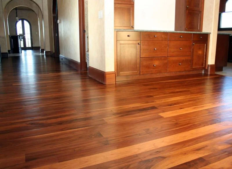 Hardwood flooring installation showcasing rich tones and custom cabinetry – ideal for home renovations in Corpus Christi TX.
