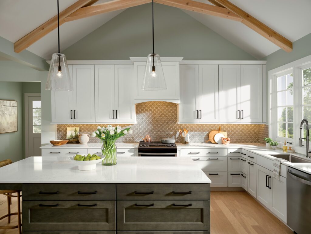 Custom white shaker kitchen cabinets with quartz countertops and modern pendant lighting – Corpus Christi home renovation.